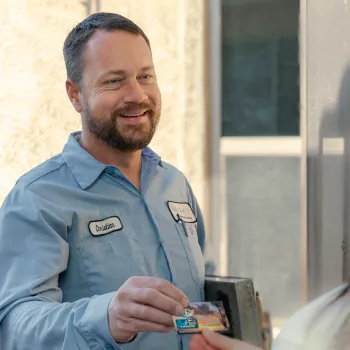 Christian Handing out Business Card